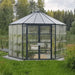 12 ft Oasis hex greenhouse installed in a garden with crystal-clear wall panels and hexagonal design