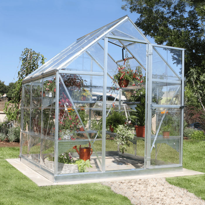 Front view of 6x6 Harmony greenhouse with hinged door and clear panels