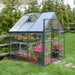 6x6 hybrid greenhouse installed outdoors with polycarbonate panels, steel base, and garden plants inside