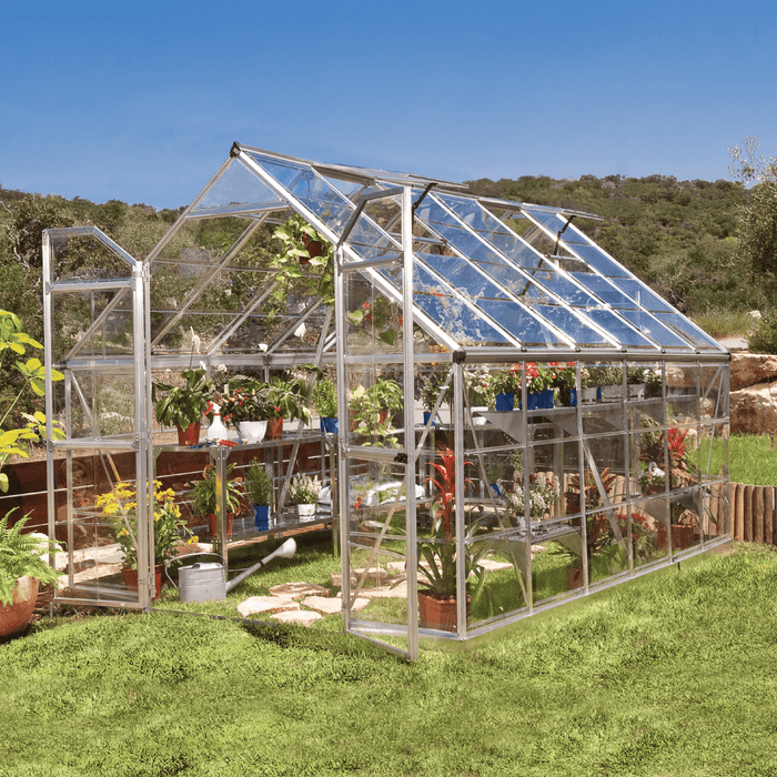 Interior and exterior view of an 8 x 12 ft Octave greenhouse filled with plants and shelving
