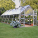 Interior of an 8 x 20ft Balance greenhouse showing shelving, pots, and growing plants