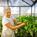 Caring for plants inside a walk-in greenhouse