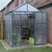 8x8 Glory greenhouse installed beside a brick wall showing compact walk-in design