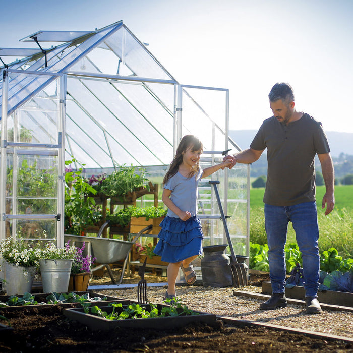 walk-in greenhouse with wide double doors for easy garden access
