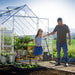 walk-in greenhouse with wide double doors for easy garden access