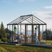 Aria 10 x 10 ft walk-in greenhouse set up as a garden retreat with seating and plants