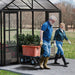 Wide double doors on Aria 10 x 10 greenhouse allowing easy wheelbarrow access
