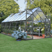 Balance 8 x 16 greenhouse installed in a backyard garden with vegetables growing inside