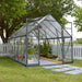 8 x 12 Balance greenhouse installed in a backyard garden with plants growing inside