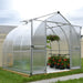 Bella 8x8 bell greenhouse installed outdoors in a backyard garden setting