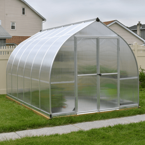 Bell-shaped Bella greenhouse with curved polycarbonate roof and wide entry doors