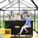 Interior view of Triomphe greenhouse showing clear wall panels and strong frame