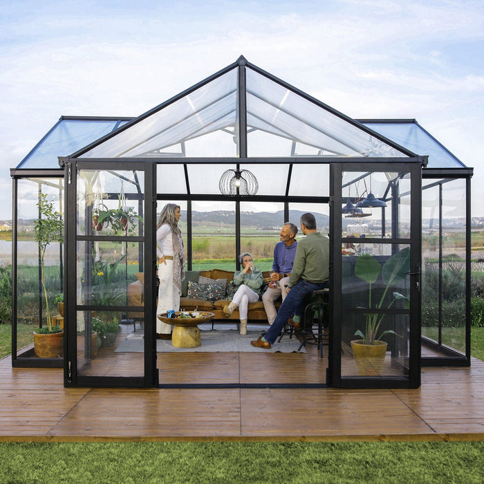 Interior of Triomphe garden chalet greenhouse showing lounge furniture and open layout