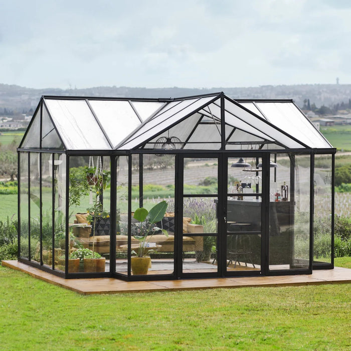 Triomphe T-shaped garden greenhouse installed on lawn with clear panels and vaulted roof