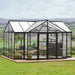 Triomphe T-shaped garden greenhouse installed on lawn with clear panels and vaulted roof