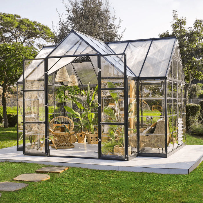 Victory 12 x 10 ft walk-in greenhouse with plants growing inside and double door access