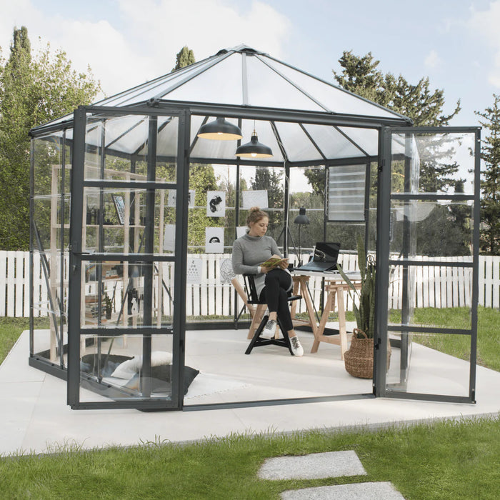 Wide double-door entry of 12 ft Oasis hex greenhouse showing spacious walk-in interior for gardening