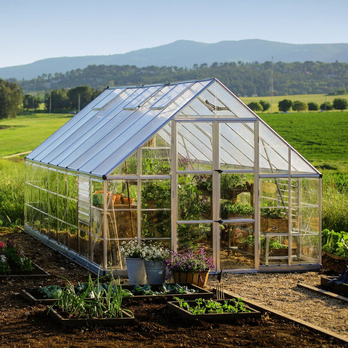 interior view of 10 × 16 balance greenhouse with plants and growing beds